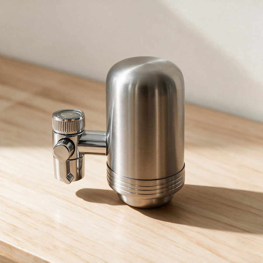 The NERŌ Kitchen Filter in brushed stainless steel, standing on a kitchen bench